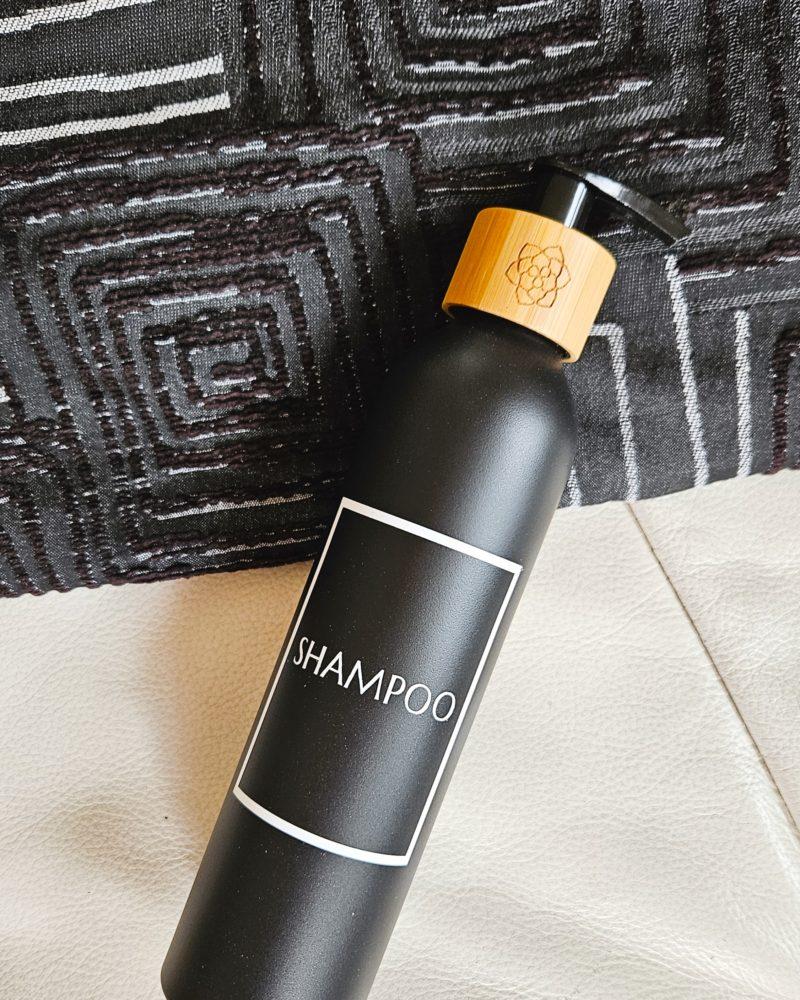 Black refillable shampoo dispenser personalized.