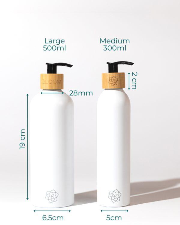 Refillable bathroom dispensers white matte with bamboo pump for minimalist bathroom in different sizes.