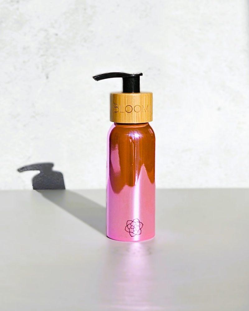 BLOOM Refillable pink shiny ecofriendly travel bottle for toiletries
