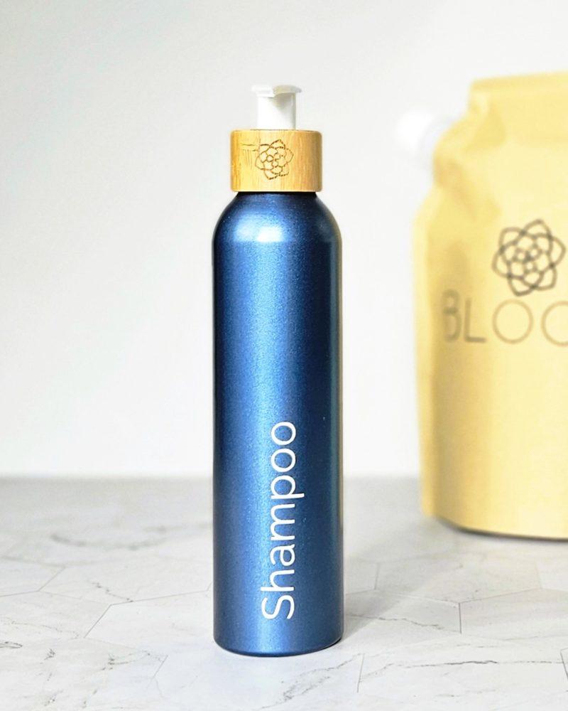 Blue refillable shampoo bottle