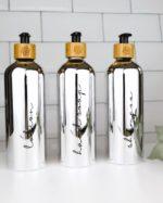 Refillable ecofriendly shower bottle set in shiny silver with bamboo pump