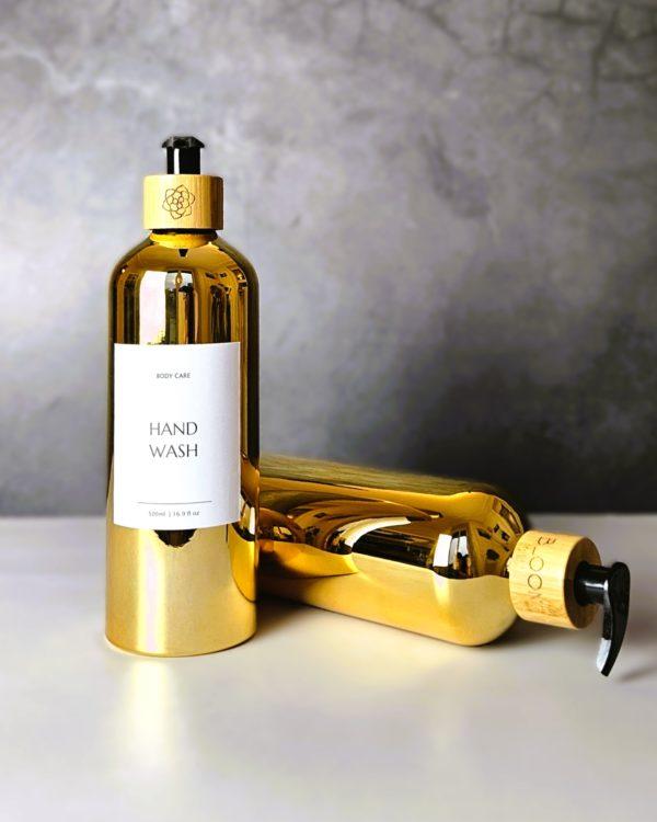 Refillable ecofriendly bathroom bottle set in shiny gold with bamboo pump