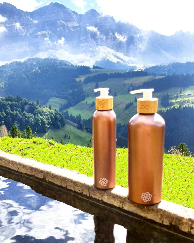 Rosegold refillable shampoo bottles in Swiss alps