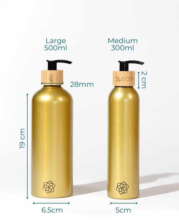 Refillable bathroom dispensers metallic gold with bamboo pump for minimalist bathroom in different sizes.