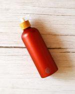Metallic red refillable soap dispenser with natural bamboo pump