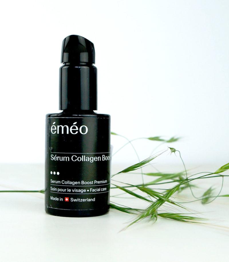 A bottle of BLOOM collagen serum showcased alongside a plant, epitomizing natural skincare.