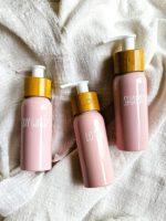 Travel bottle set in pink for shampoo, lotion and shower gel. Personalized with white vinyl decal.