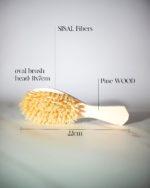 Natural Hair Brush, a biodegradable, artisan-crafted tool made from pine wood and natural sisal bristles.