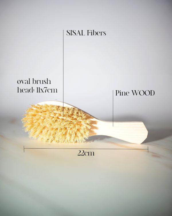 Natural Hair Brush, a biodegradable, artisan-crafted tool made from pine wood and natural sisal bristles.