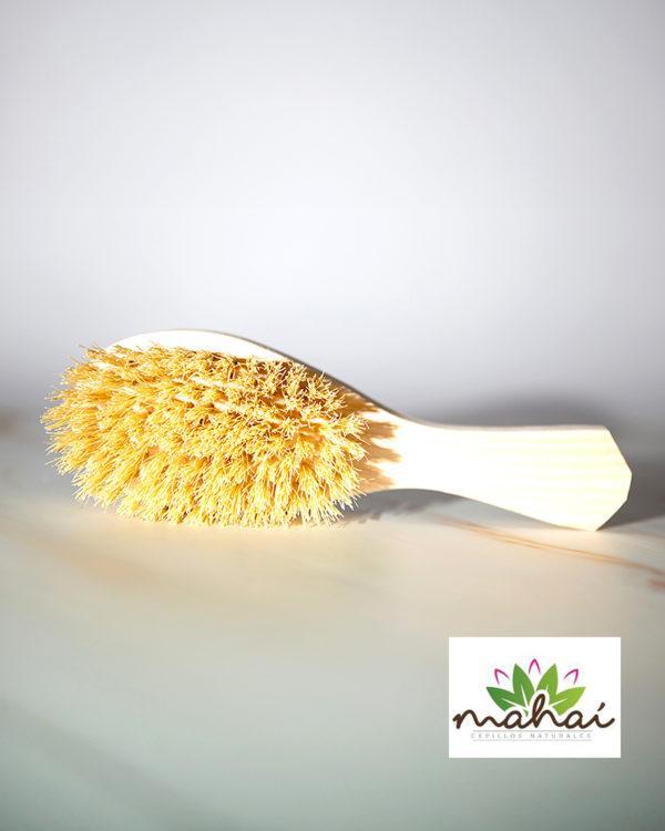 Natural Hair Brush, a biodegradable, artisan-crafted tool made from pine wood and natural sisal bristles.